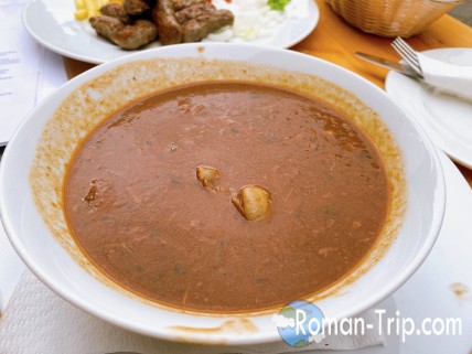 A hearty serving of Croatian-style goulash, featuring tender meat and rich, flavorful sauce with a unique local twist. This comforting dish showcases the blend of regional ingredients and traditional culinary techniques.