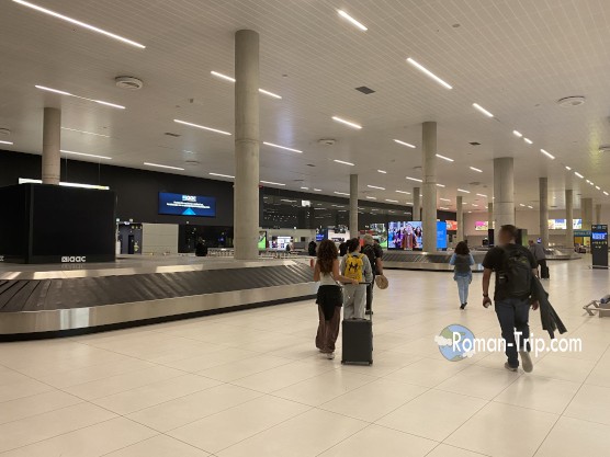 Zagreb Airport baggage claim area where passengers pick up their checked luggage.