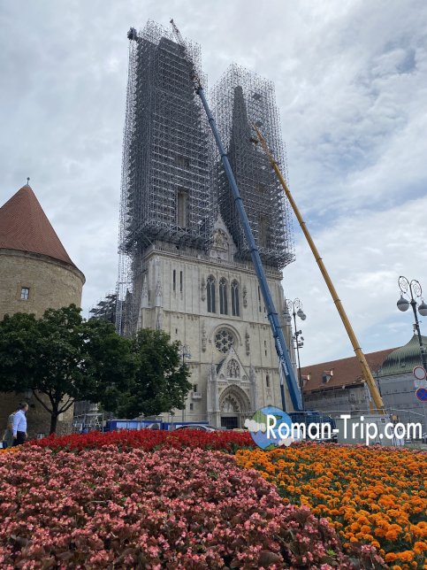 The stunning Zagreb Cathedral, beautifully framed by a flowerbed in the foreground.